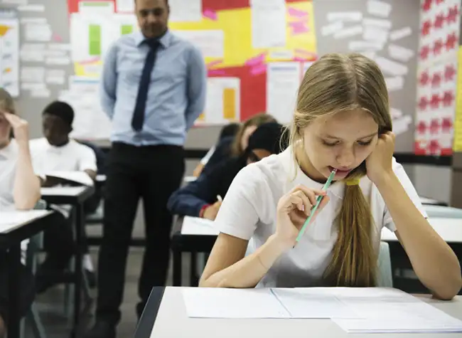 students-doing-the-exam-in-classroom